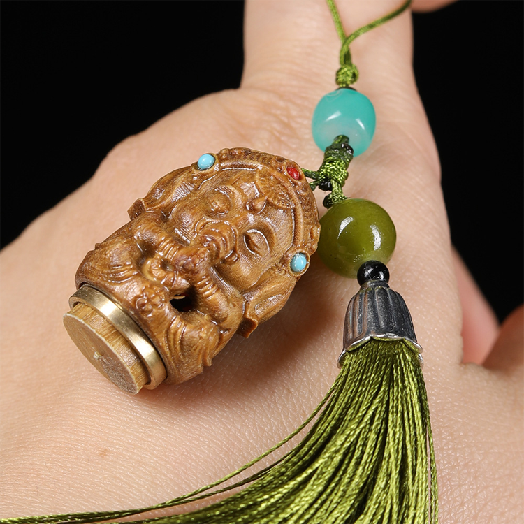 Natural Green Sandalwood Hollow Carved Elephant Head God Pendant